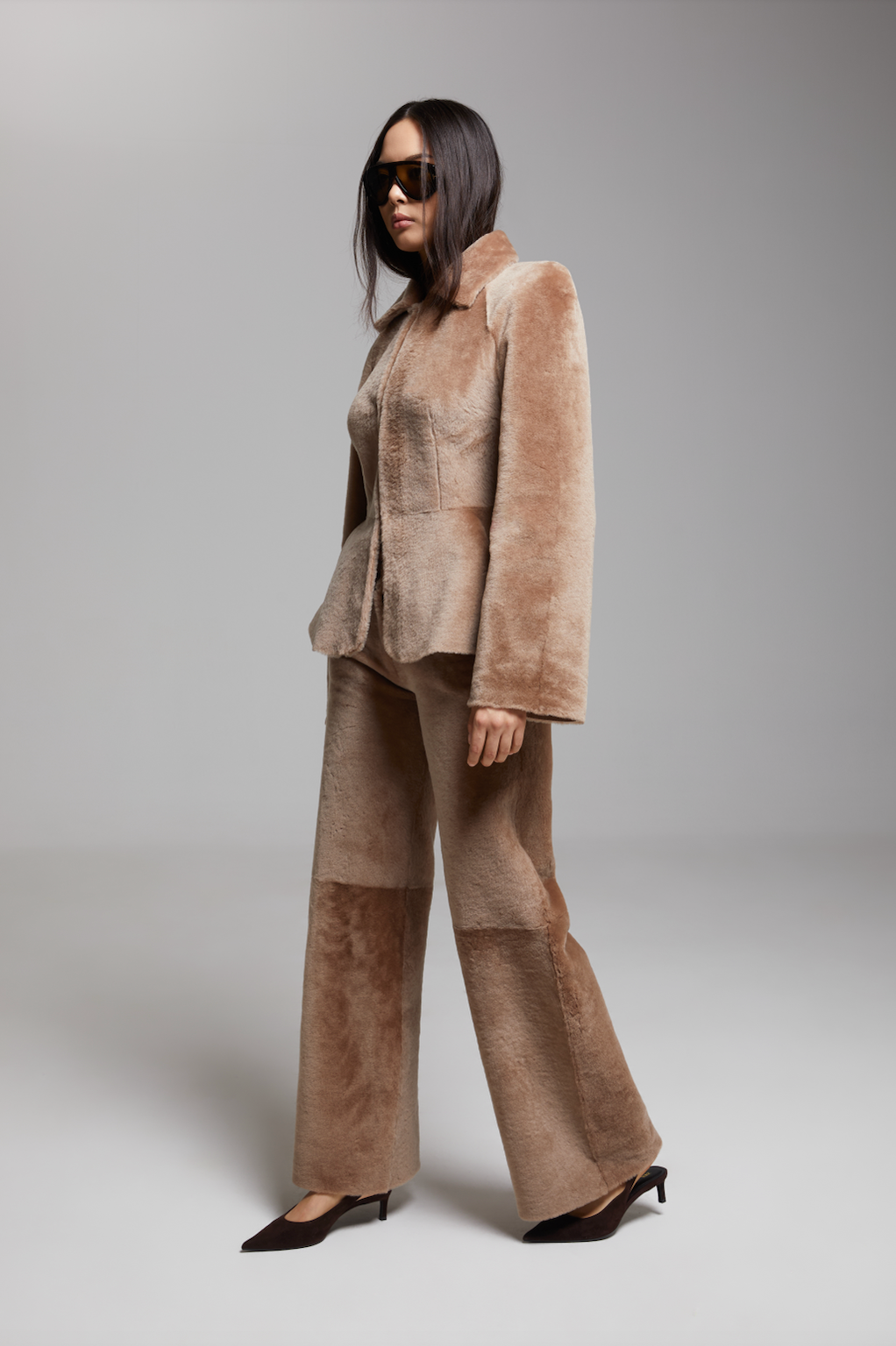 BIENBIE Allegro shearling pants in beige, featuring a cozy, plush shearling exterior and relaxed fit for casual wear.