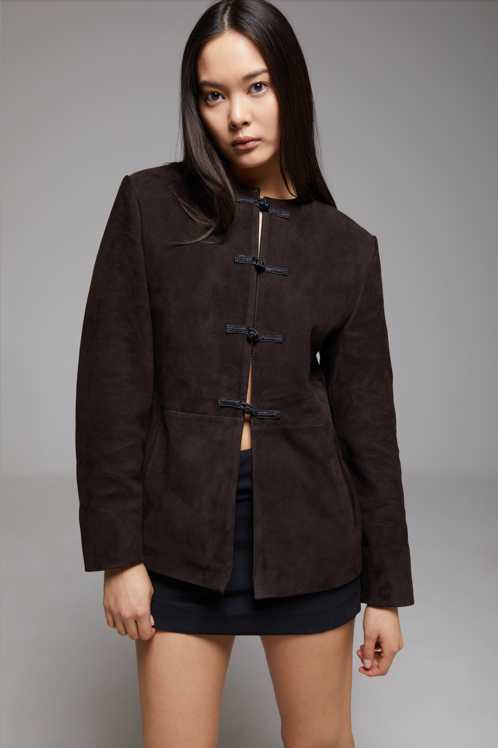 Black BIENBIE Concerto Jacket displayed on a hanger, featuring a sleek design with a front zipper and collar, casual outerwear for men.