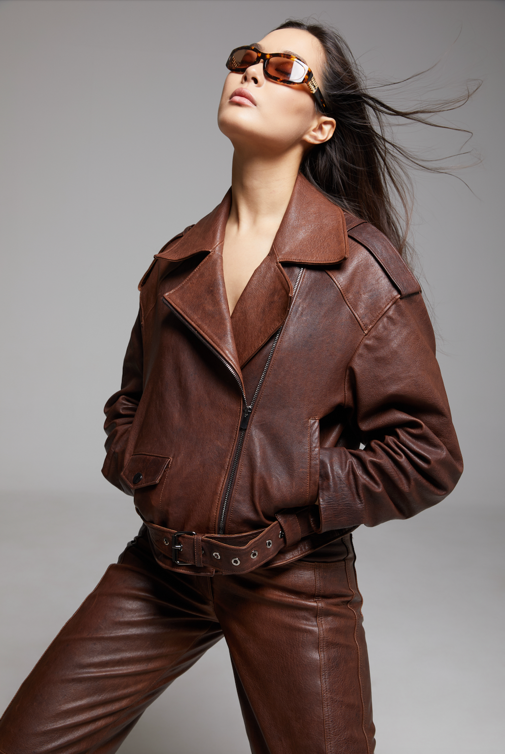 Black BIENBIE Rondo Jacket shown on a hanger, featuring a sleek design with a high collar and zip-up front.