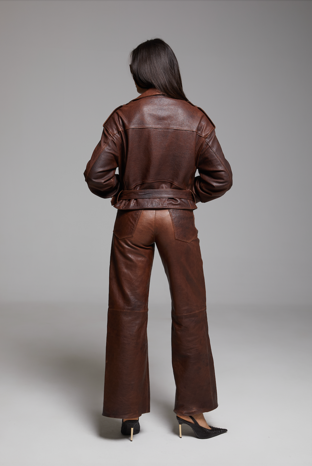 Black BIENBIE Rondo Jacket displayed on a hanger, showcasing its sleek design and stylish fit.