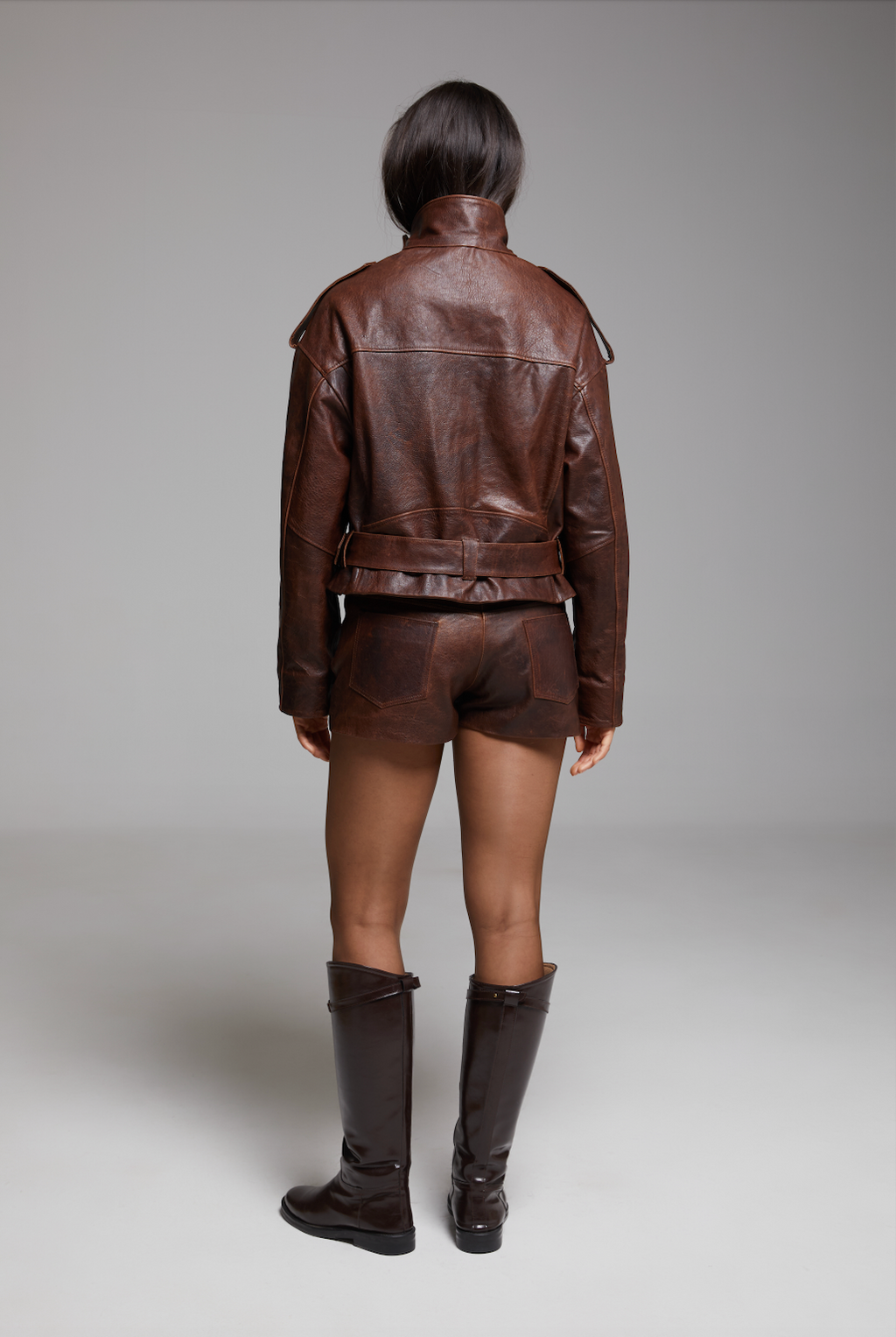 Black Rondo Shorts by BIENBIE with an elastic waistband and relaxed fit, shown in a detailed product screenshot.