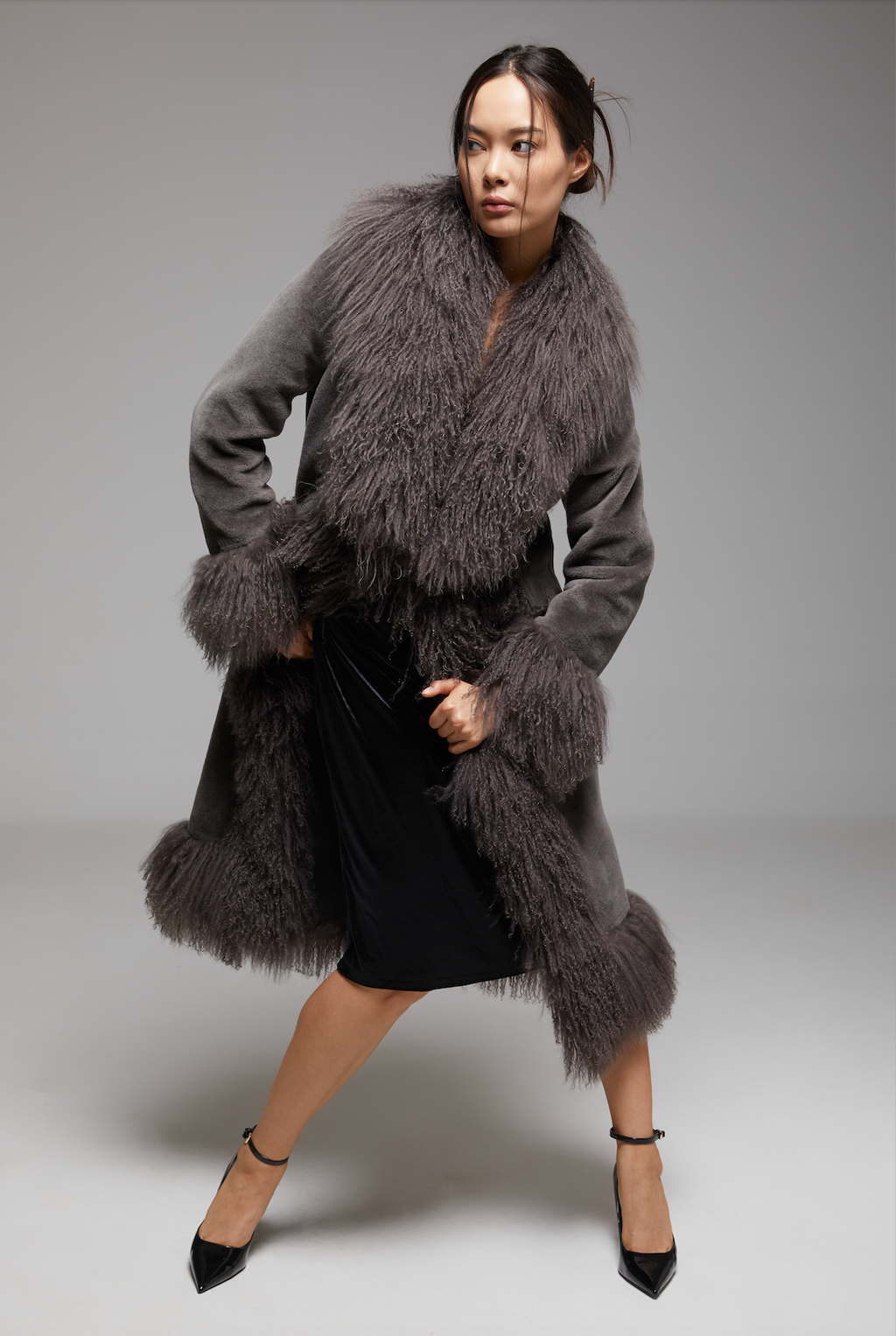 WALTZ The Grand Coat by BIENBIE displayed in a screenshot, showcasing a stylish, elegant outerwear piece with detailed fabric texture.