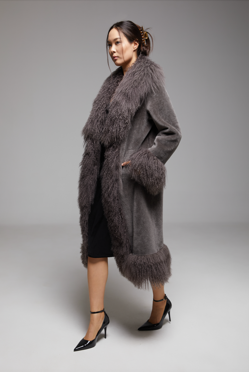BIENBIE Waltz The Grand Coat, stylish women’s coat with tailored fit, shown in a screenshot highlighting its elegant design.