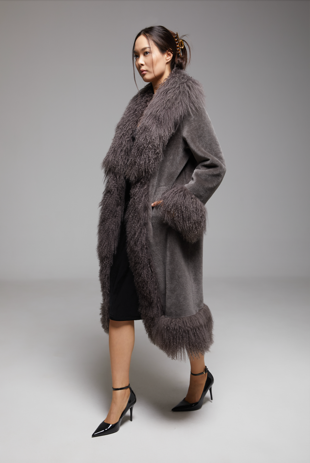 BIENBIE Waltz The Grand Coat, stylish women’s coat with tailored fit, shown in a screenshot highlighting its elegant design.