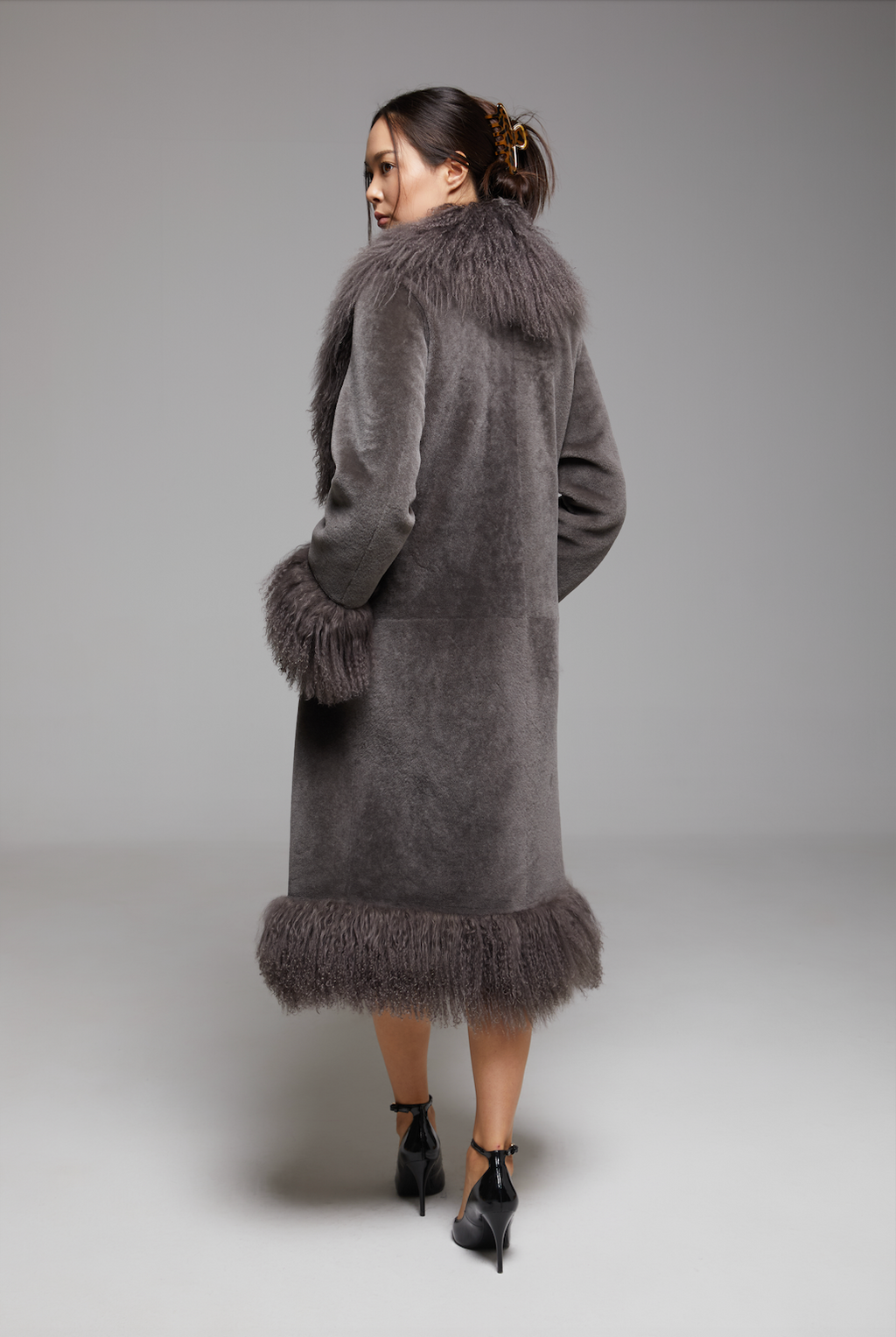 Waltz The Grand Coat by BIENBIE displayed on a mannequin, showcasing its tailored design and elegant fabric.