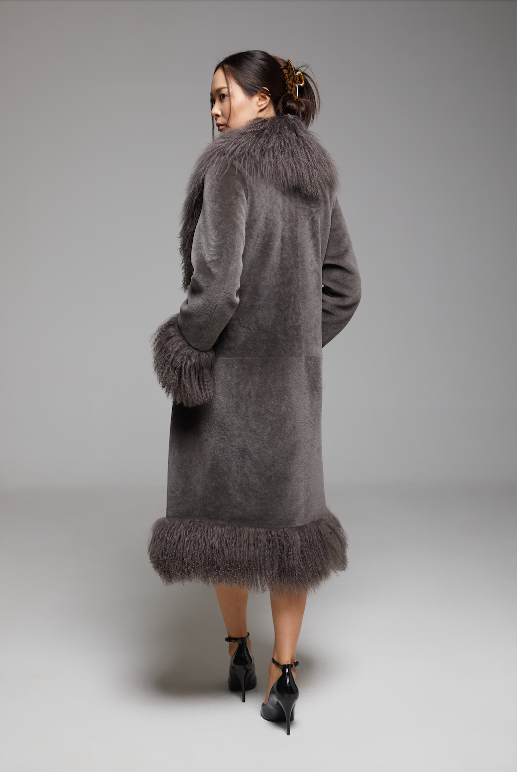 Waltz The Grand Coat by BIENBIE displayed on a mannequin, showcasing its tailored design and elegant fabric.