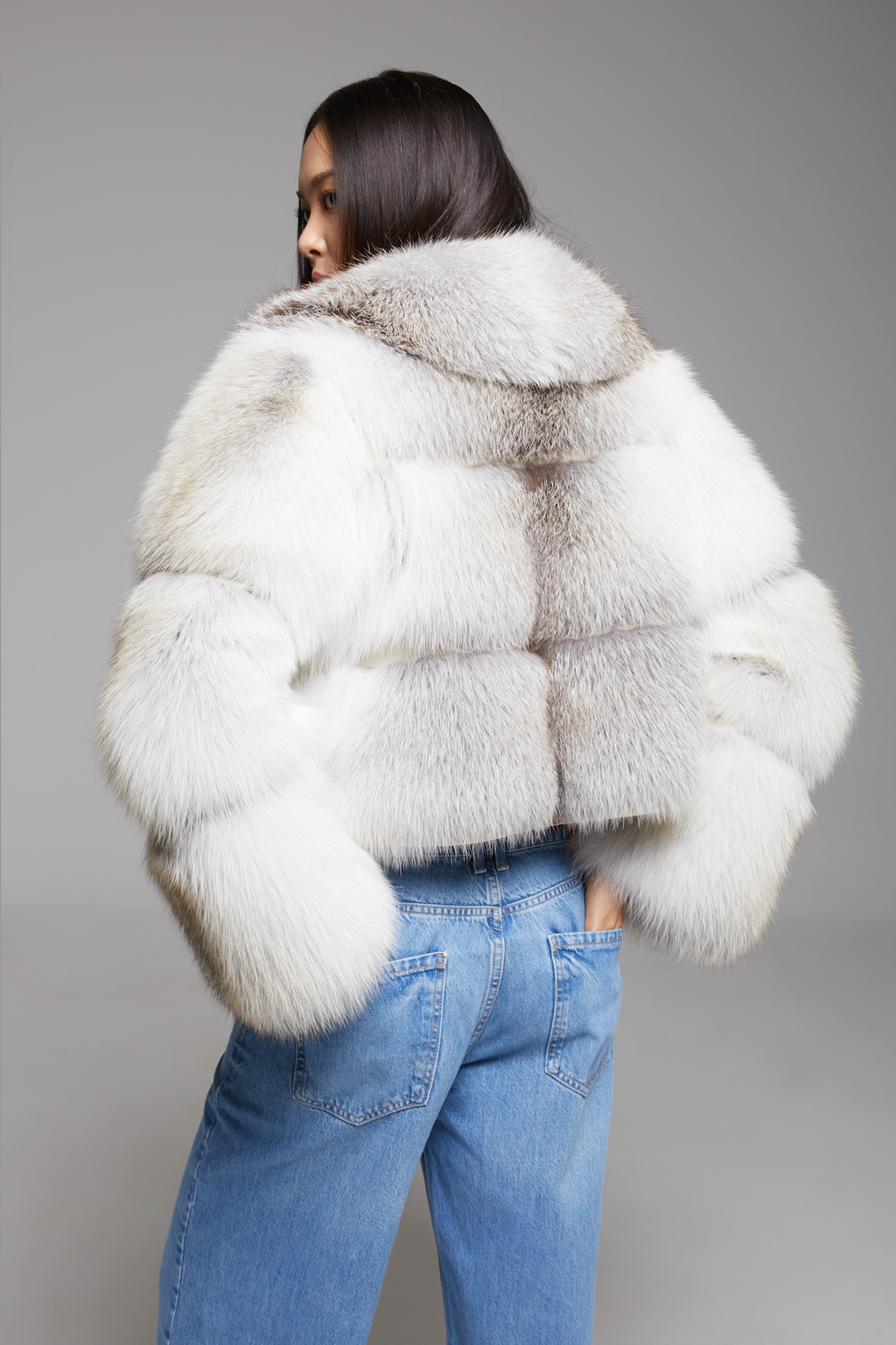 BIENBIE Aria Coat displayed on a hanger, featuring a stylish, lightweight outerwear design in neutral fabric.