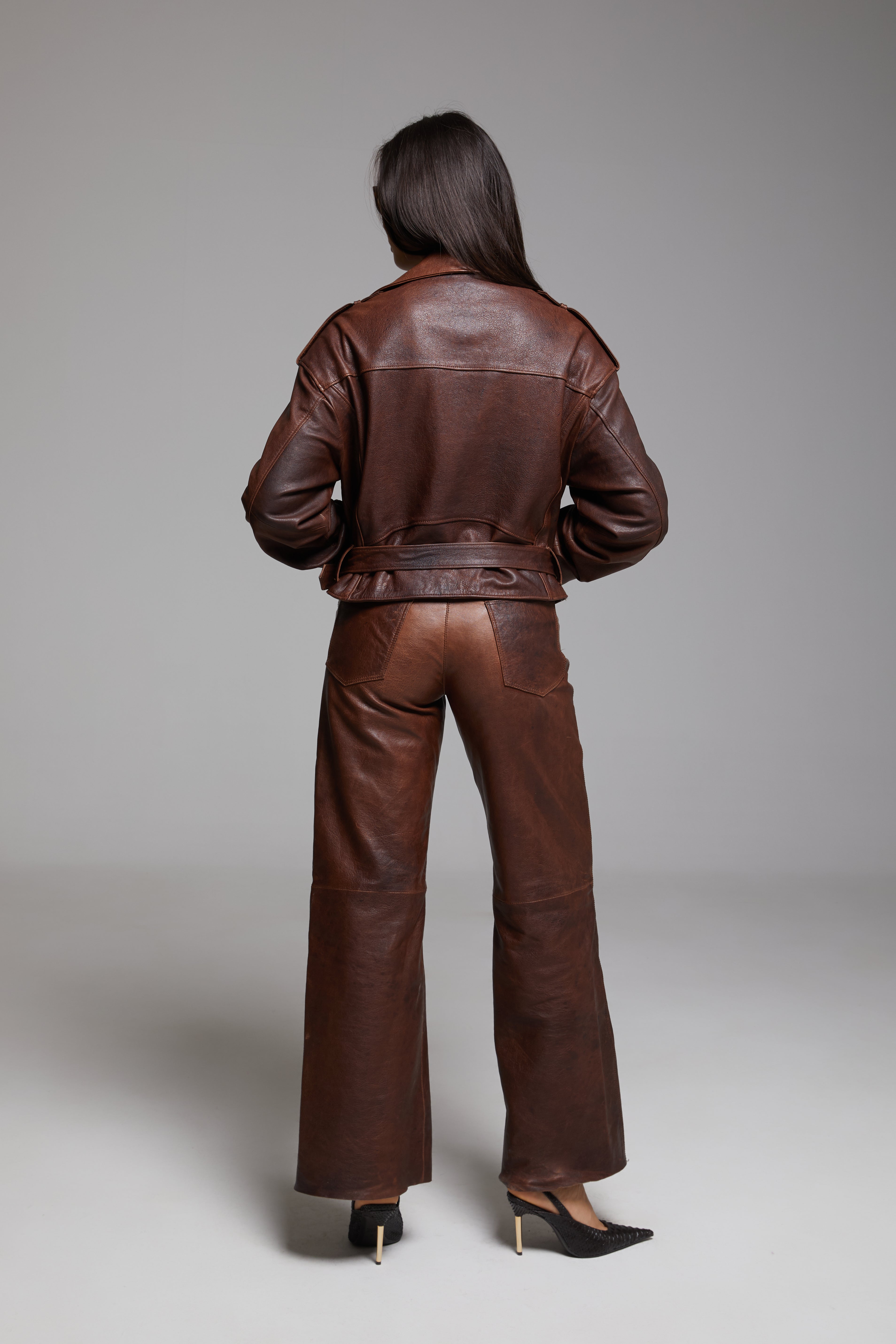Rondo leather pants by BIENBIE featuring a fitted design, black leather material, and stylish detailing visible in the image.