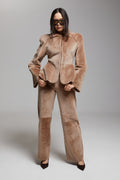 BIENBIE Allegro shearling pants in soft, cozy material with a relaxed fit, shown on a model against a neutral background.