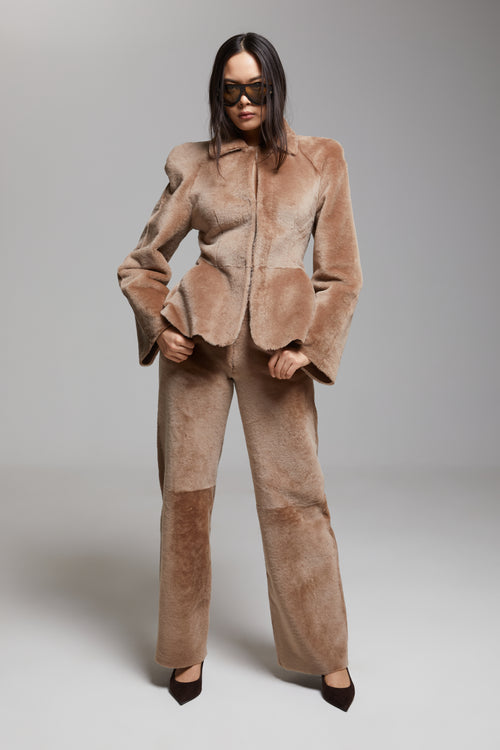 BIENBIE Allegro shearling pants in soft, cozy material with a relaxed fit, shown on a model against a neutral background.