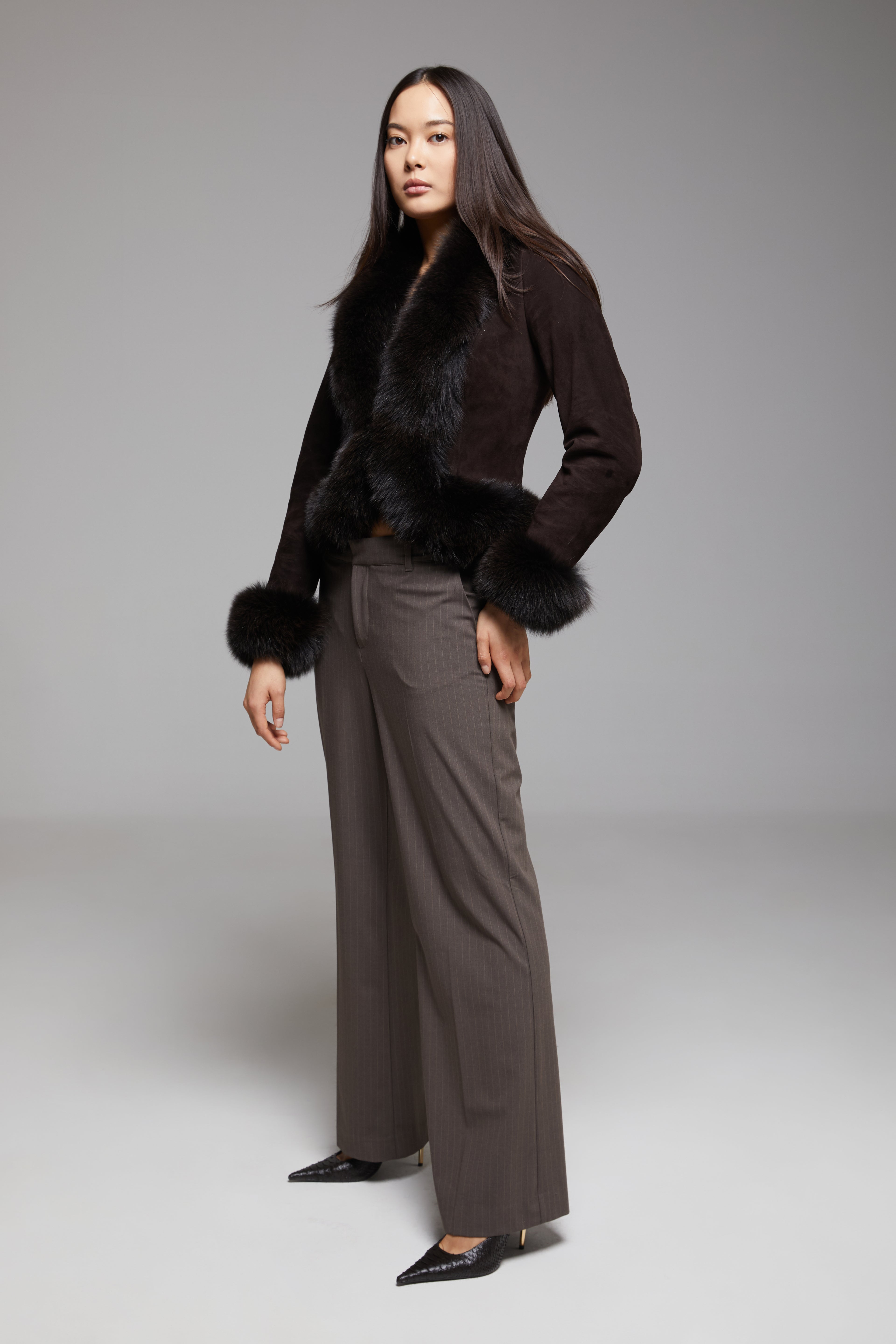 Light gray BIENBIE Tempo Jacket displayed on a hanger, featuring a sleek design and full-length zipper.